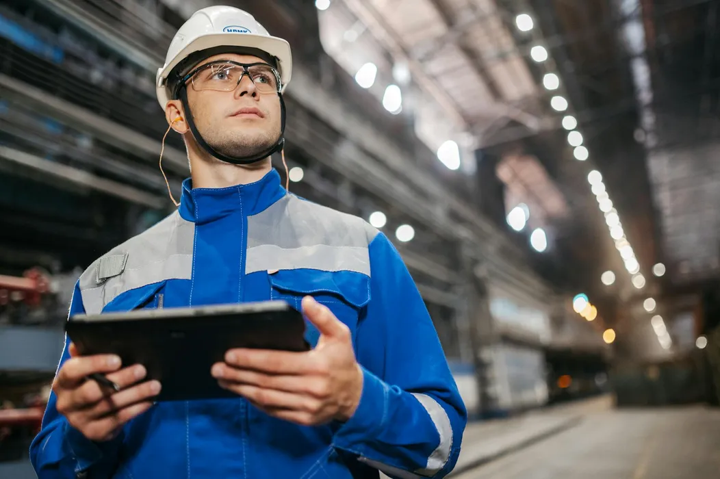 Operations staff reviewing an incident report and site evidence on a digital workflow