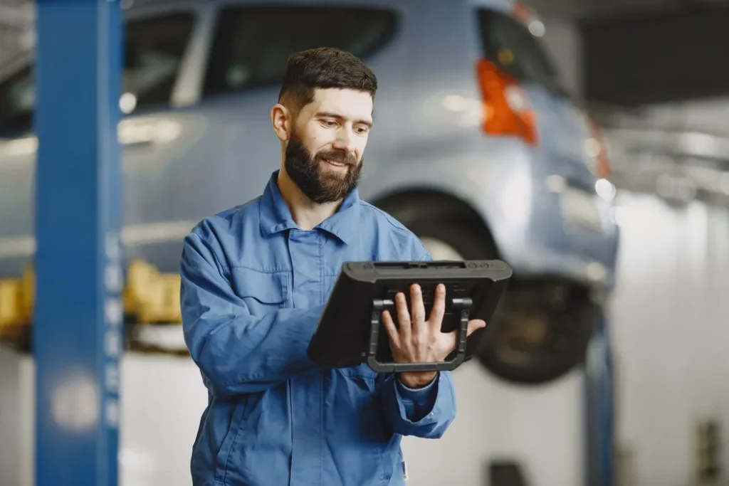 Field service technician reviewing a digital service report after job completion