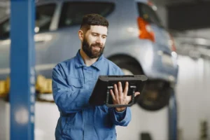 Field service technician reviewing a digital service report after job completion