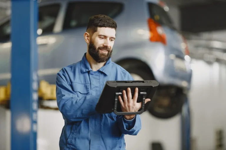 Field service technician reviewing a digital service report after job completion